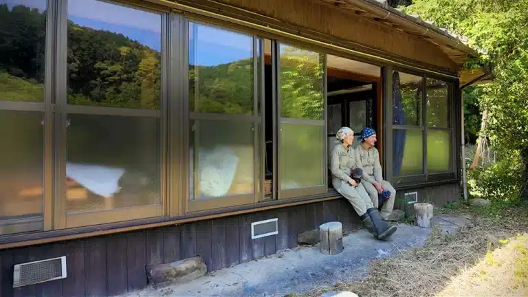 two people sitting on engawa in a Japanese house